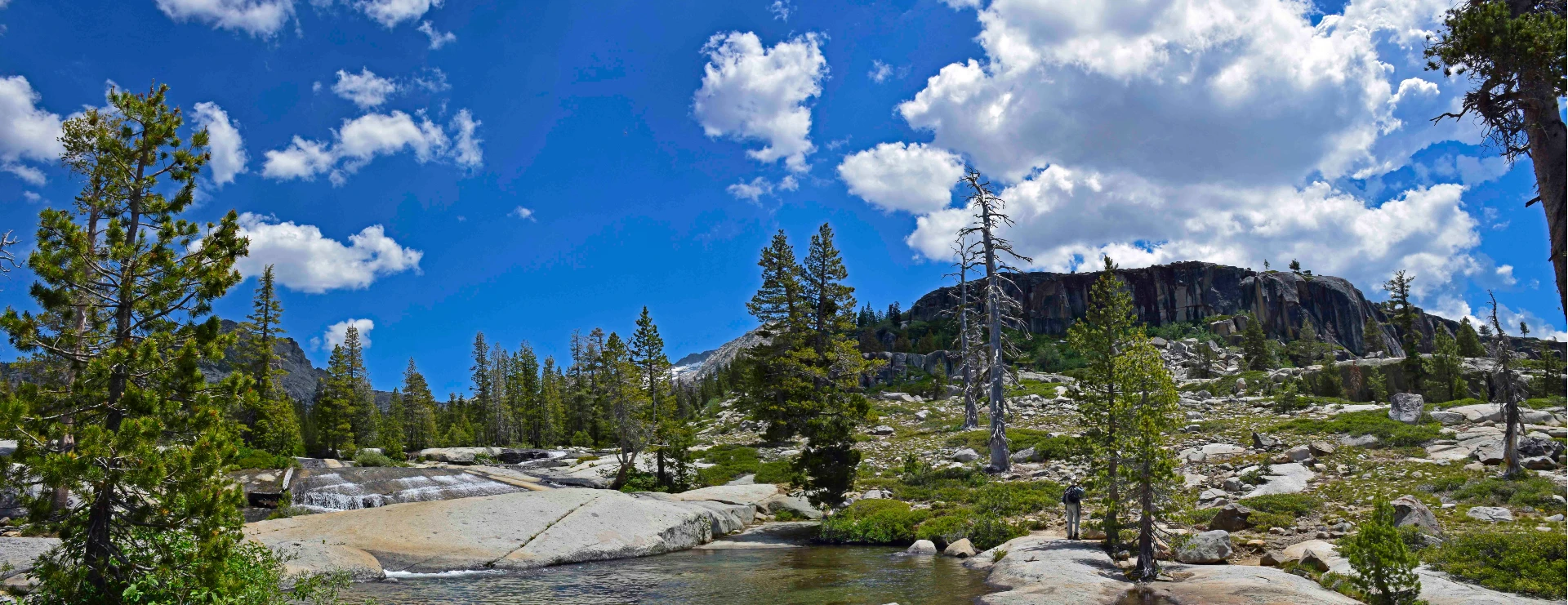 Granite wilderness, Creek, cloudy day with blue sky