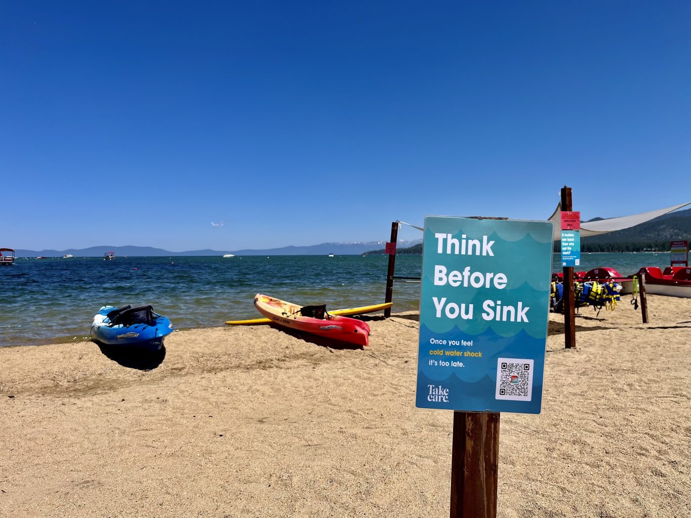 Tahoe Beach, kayaks, sign