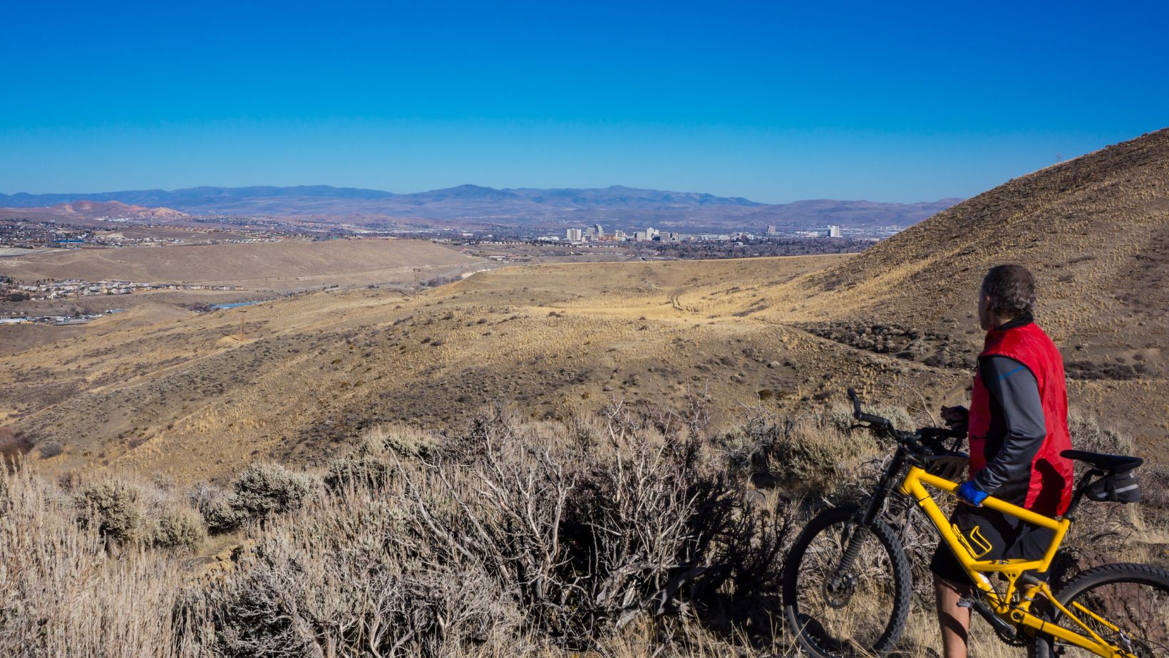 Mountain biker on trail above Reno