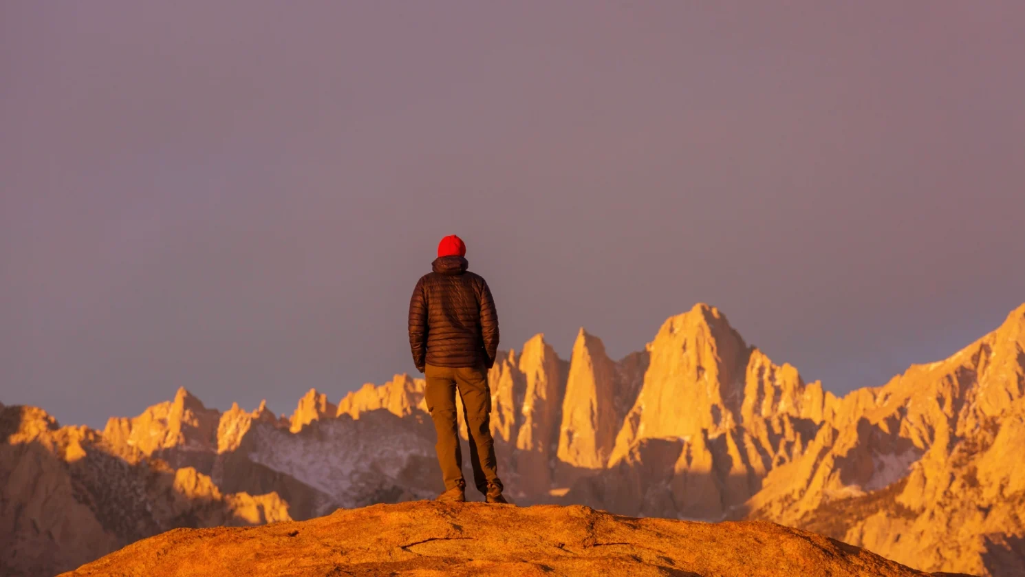 Man in red hat staring at Mt Whitney